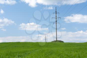 Royalty Free Photo of High Tension Poles in a Field