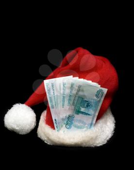 Royalty Free Photo of a Santa Hat and Money