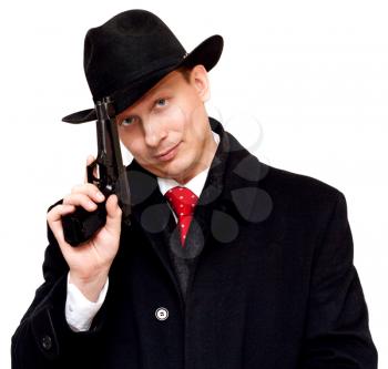 Royalty Free Photo of a Man in a Suit Holding a Gun
