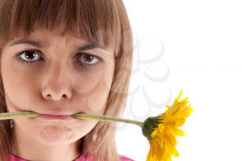 Royalty Free Photo of a Girl With a Flower in Her Mouth
