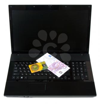 Royalty Free Photo of Money on a Laptop