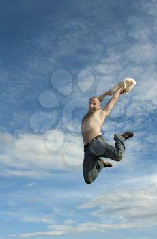 Royalty Free Photo of a Man Jumping in the Air