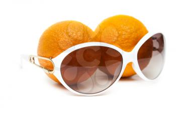 Royalty Free Photo of a Pair of Sunglasses and Oranges