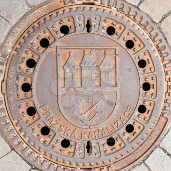 Royalty Free Photo of a Rusty Manhole in Prague