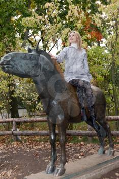 Royalty Free Photo of a Woman on a Horse Statue
