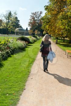 Royalty Free Photo of a Girl Walking in a Park