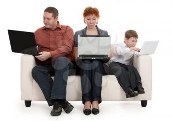 Royalty Free Photo of a Family Sitting With Laptops
