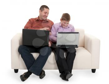 Royalty Free Photo of a Father and Son Playing With Laptops