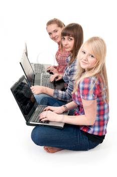 Royalty Free Photo of Three Girls Using Laptops