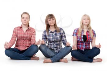 Royalty Free Photo of Three Girls Meditating