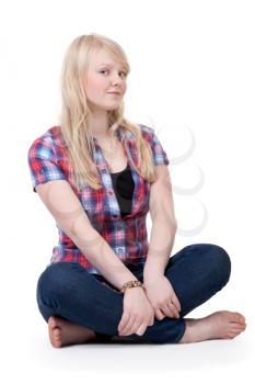 Royalty Free Photo of a Girl Sitting in Lotus Pose