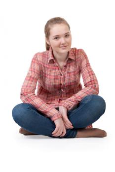 Royalty Free Photo of a Girl Sitting in Lotus Position