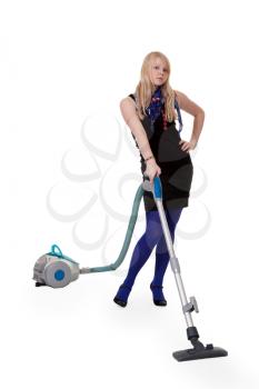 Royalty Free Photo of a Girl With a Vacuum Cleaner