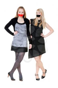 Royalty Free Photo of Two Girls With Their Mouths Taped Shut