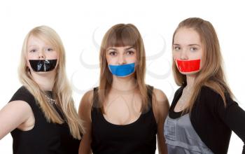 Royalty Free Photo of Three Girls With Their Mouths Taped Shut