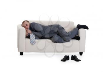 Royalty Free Photo of a Businessman Sleeping on a Couch