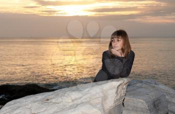 Royalty Free Photo of a Girl by the Water