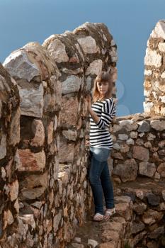 Royalty Free Photo of a Woman Visiting an Old Fortress