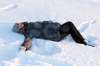 Royalty Free Photo of a Young Woman Lying in Snow