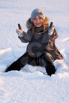 Royalty Free Photo of a Young Woman Sitting in the Snow