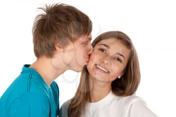 Royalty Free Photo of a Teenage Boy Kissing a Girl