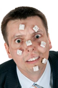 Royalty Free Photo of a Businessman With Computer Keys on His Face