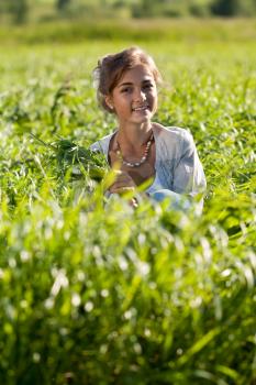 Royalty Free Photo of a Young Woman in a Field