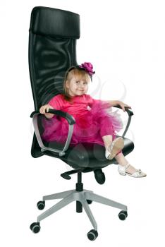 Royalty Free Photo of a Girl Sitting in a Chair