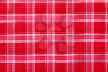 Red plaid fabric in the background