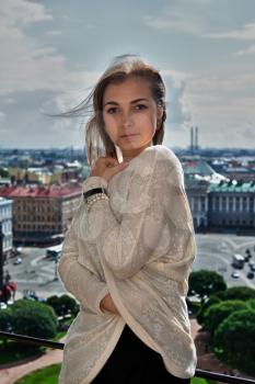 Portrait of a beautiful girl on the roof of St. Isaac's Cathedral of St. Petersburg
