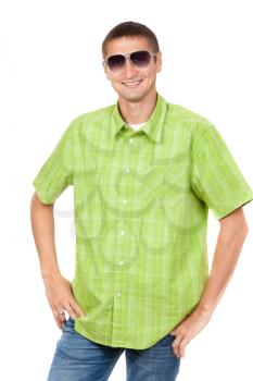 Portrait of a man aged 25 years, wearing sunglasses in a plaid shirt, green studio isolated on white background