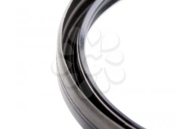 Crankshaft rear oil seal closeup isolated on white background