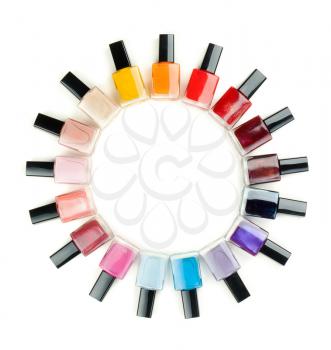 Nail polish arranged in a circle on a white background