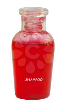 Small red bottle of shampoo isolated on white background
