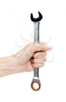 Woman's hand holding a chrome wrench. Isolate on white.