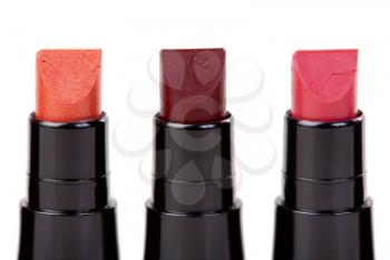 Three lipstick set in a row, isolated on white background