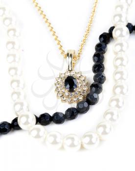 beads and chain with a pendant on a white background