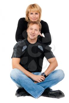 Beautiful couple in love sitting in the lotus position, isolate on white