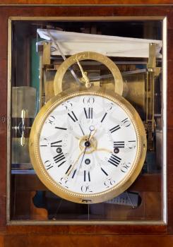 Antique Clock with Roman Numerals in wooden case