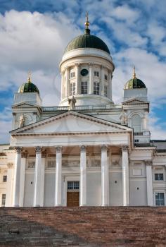 Tuomiokirkko cathedral Helsinki. Finland. against the sky with clouds