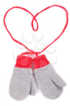 pair of gray baby mittens on a string in the form of heart. Isolate on white background.