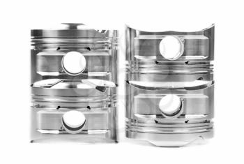 Set of four chrome-plated forged pistons. Isolate on white