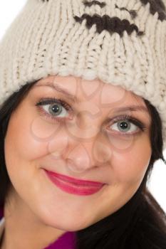Portrait of a beautiful brunette in a warm hat,  close-up