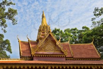 Oriental temple decorated with a golden roof in Siem Reap, Cambodia
