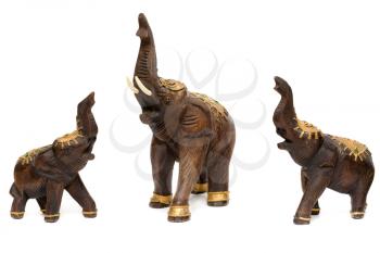 Three wooden statues of elephants, isolate on white