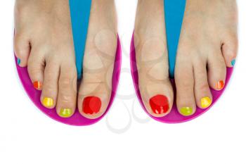 Beautiful female feet with a pedicure color. Isolated on white background