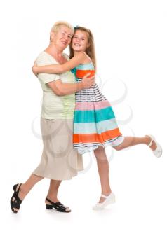 Grandmother with her granddaughter in the studio on a white isolate