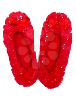 Red sheepskin slippers on a white background