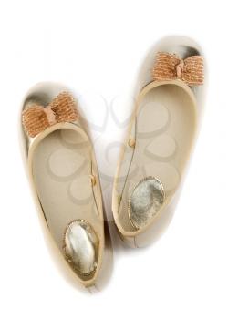 Gold ballet shoes for women. View from above. Isolate on white.