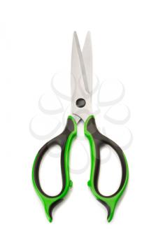 Steel scissors with rubber grips, green and black. Isolate on white.